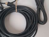 a black cord that is connected to a charger on a table