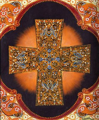 an image of a decorative cross is displayed on a wall