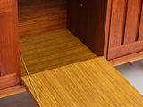 a wooden desk with a drawer underneath it