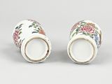 pair of chinese porcelain vases with floral designs on them