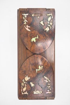 a picture of a wooden wall hanging on the wall
