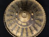 an image of a decorative bowl on a black surface