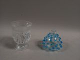 two glass vases sitting next to each other on a table