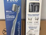 a box of toothbrushes sitting on a table next to a box of toothbrushes