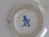 a white plate with a blue design on it
