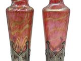 two vases that are sitting side by side on a white background