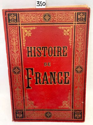 a red book with black writing on it sitting on a white surface