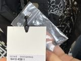 a person holding a tag with a picture of a cat on it