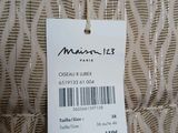 a label on the back of a dress with a price tag on it