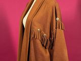 a brown jacket with fringes on a mannequin mannequin mannequin mannequin mannequin mannequin mannequin mannequin