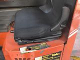 a forklift that has a seat on the back of it