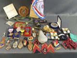 a lot of medals and other items on a table