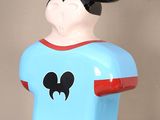 a mickey mouse figurine that is on a table