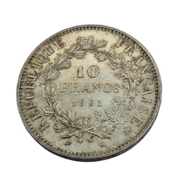 an old silver coin with a wreath on top of it