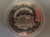 a close up of a coin in a plastic container on a table
