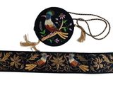 black and gold embroidered belt with birds and flowers on it