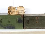 two trunks sitting on top of each other on a shelf