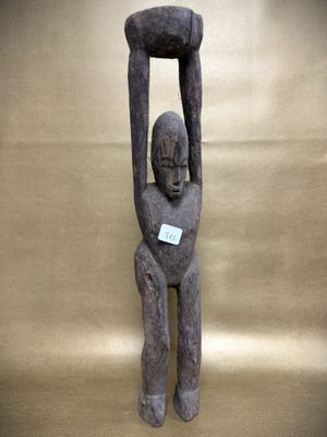 an image of a statue of a man holding a piece of wood