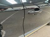 a reflection of a car on the side of the road