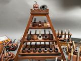 many different types of pipe holders and pipes on display