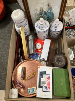 a box with many items in it sitting on the floor