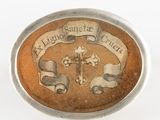 a picture of a badge with a cross on it