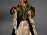 statue of a man dressed in a black and gold outfit