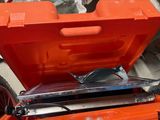 an orange tool box with a pair of glasses in it