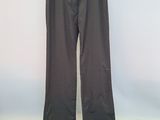an image of a pair of gray pants hanging on a hanger