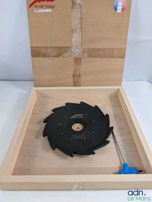 a box with a circular blade in it on a table