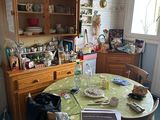 a table with a green table cloth on it in a kitchen