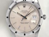 an image of a rolex stainless steel watch with a white dial