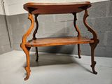a small wooden table with a shelf on top of it