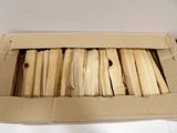 a box full of sticks of wood sitting on a table