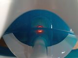 a close up of a toothbrush with a red light in it