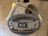 a close up of a machine with a hose attached to it ' s side