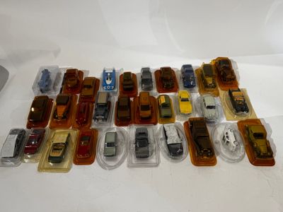 a lot of toy cars that are sitting on a table