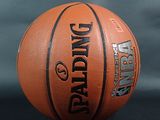 an image of a basketball ball on a black surface