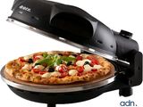 a pizza that is being cooked on a pizza stone