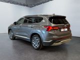 the rear end of a silver 2020 hyundai santa parked in a showroom
