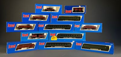 a lot of toy trains that are in the boxes