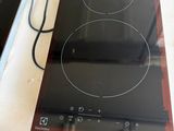 two electric burners on the counter top of the stove