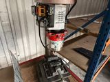 an image of a drill on a table in a warehouse