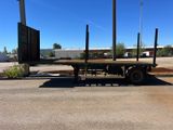 a flatbed truck that is parked in the parking lot