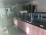 a glass display case in the middle of a room