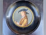painting of a man in a blue hat in a silver frame