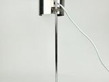 a lamp that is on top of a metal stand