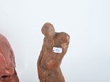 two sculptures of a man and a woman on display