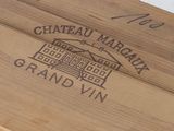 a close up of a wooden box with a wine label on it