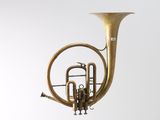 a brass instrument that is hanging from the ceiling